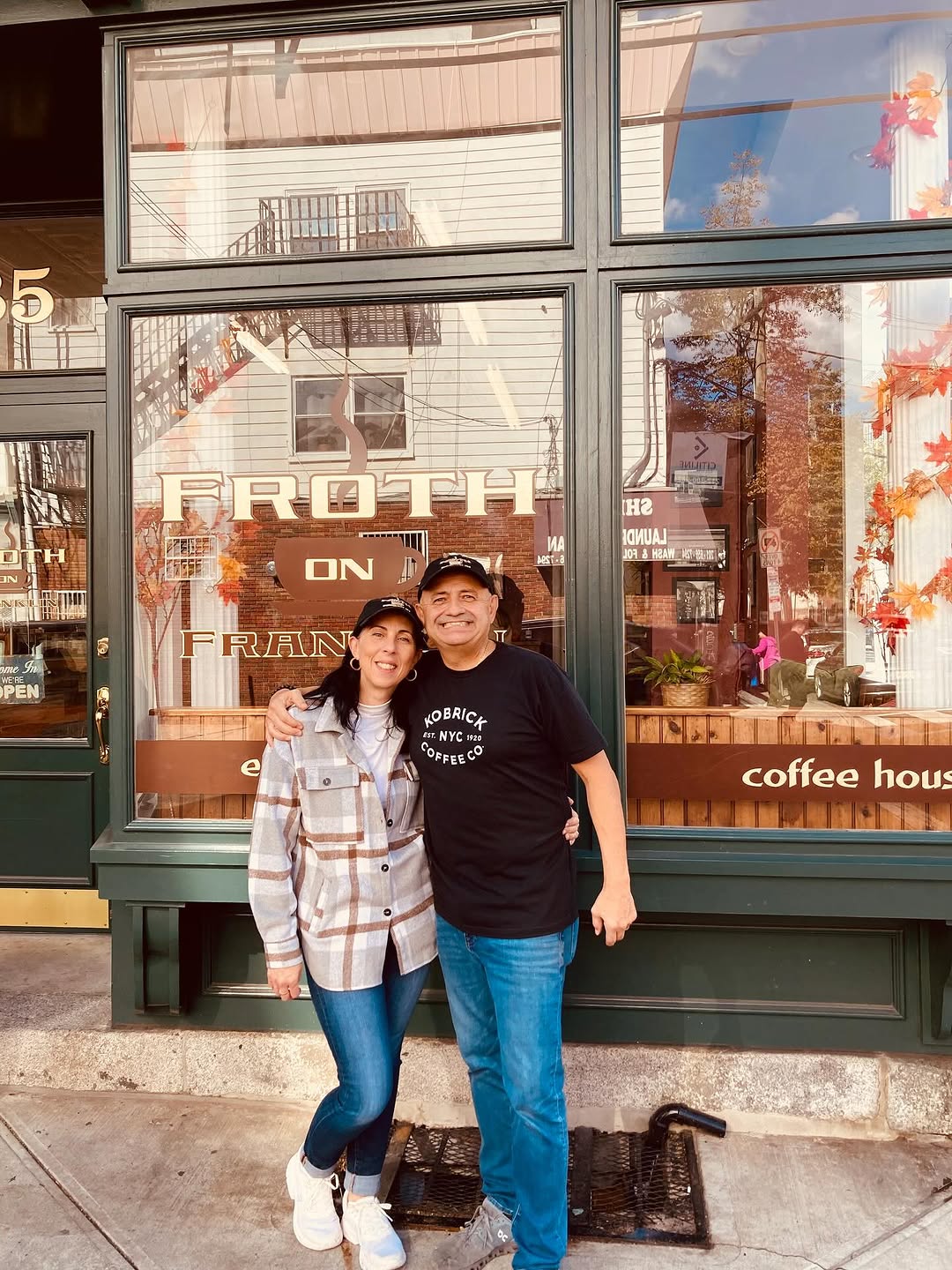 Al and Maria Ciminata, owners of FROTH on Franklin, standing in front of their coffee shop on Franklin Street